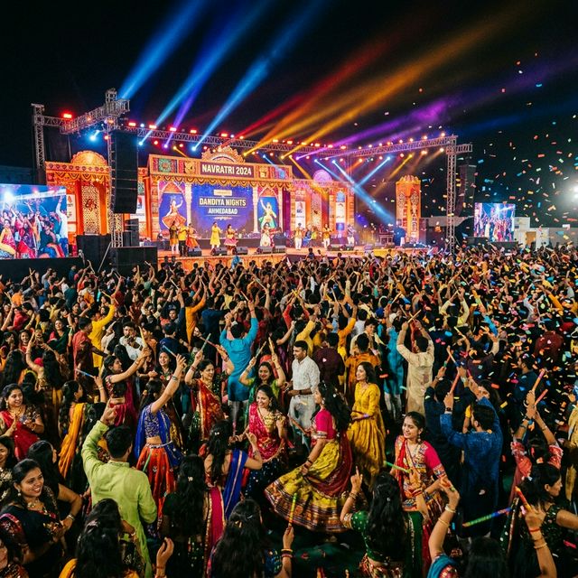 Energetic festival crowd at Garba Night Ahmedabad with stage lighting